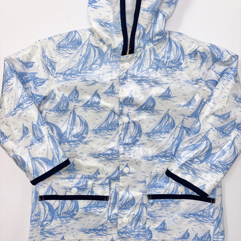 The Beaufort Bonnet Co Blue Sailboat Print Hooded Rain Jacket